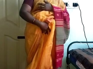 desi  indian sultry tamil telugu kannada malayalam hindi cheating wife vanitha wearing orange colour saree  in the same manner chunky boobs with an increment of shaved pussy press hard boobs press nip scraping pussy masturbation